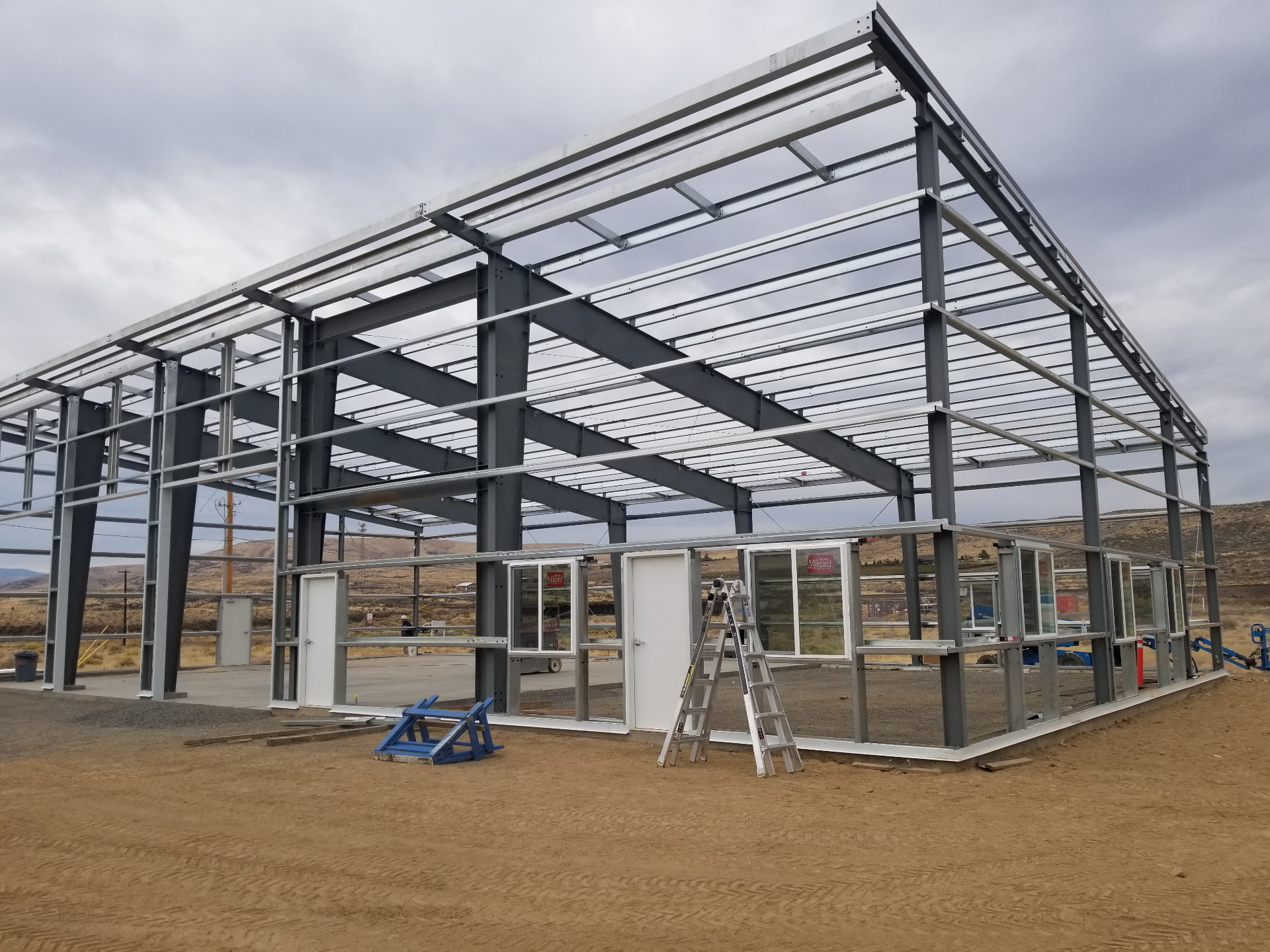 Steel building with windows and framed openings installed