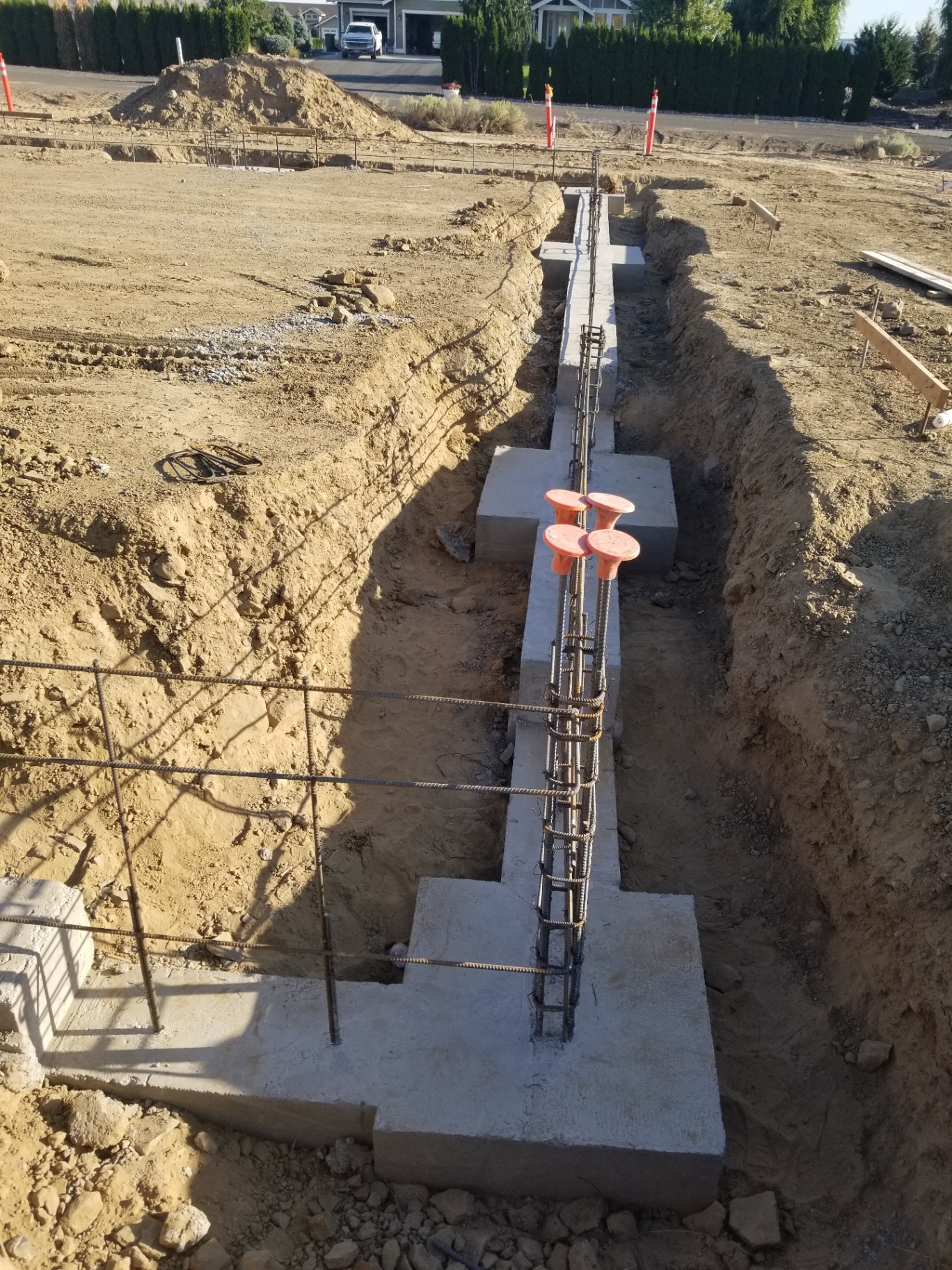 Poured stem wall with rebar tied for next pour