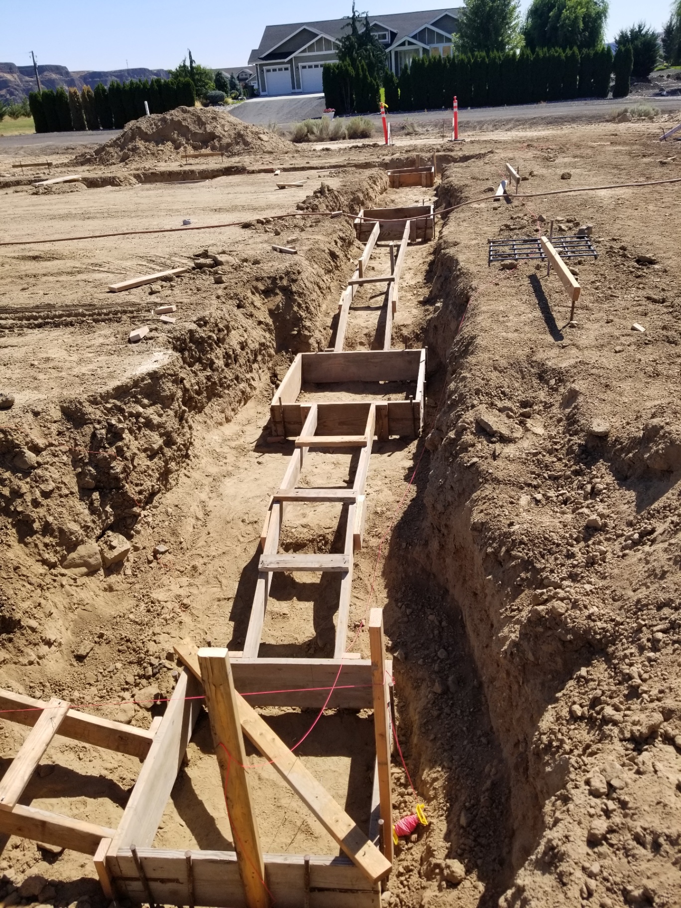 Stepped footing forms with rebar grids set