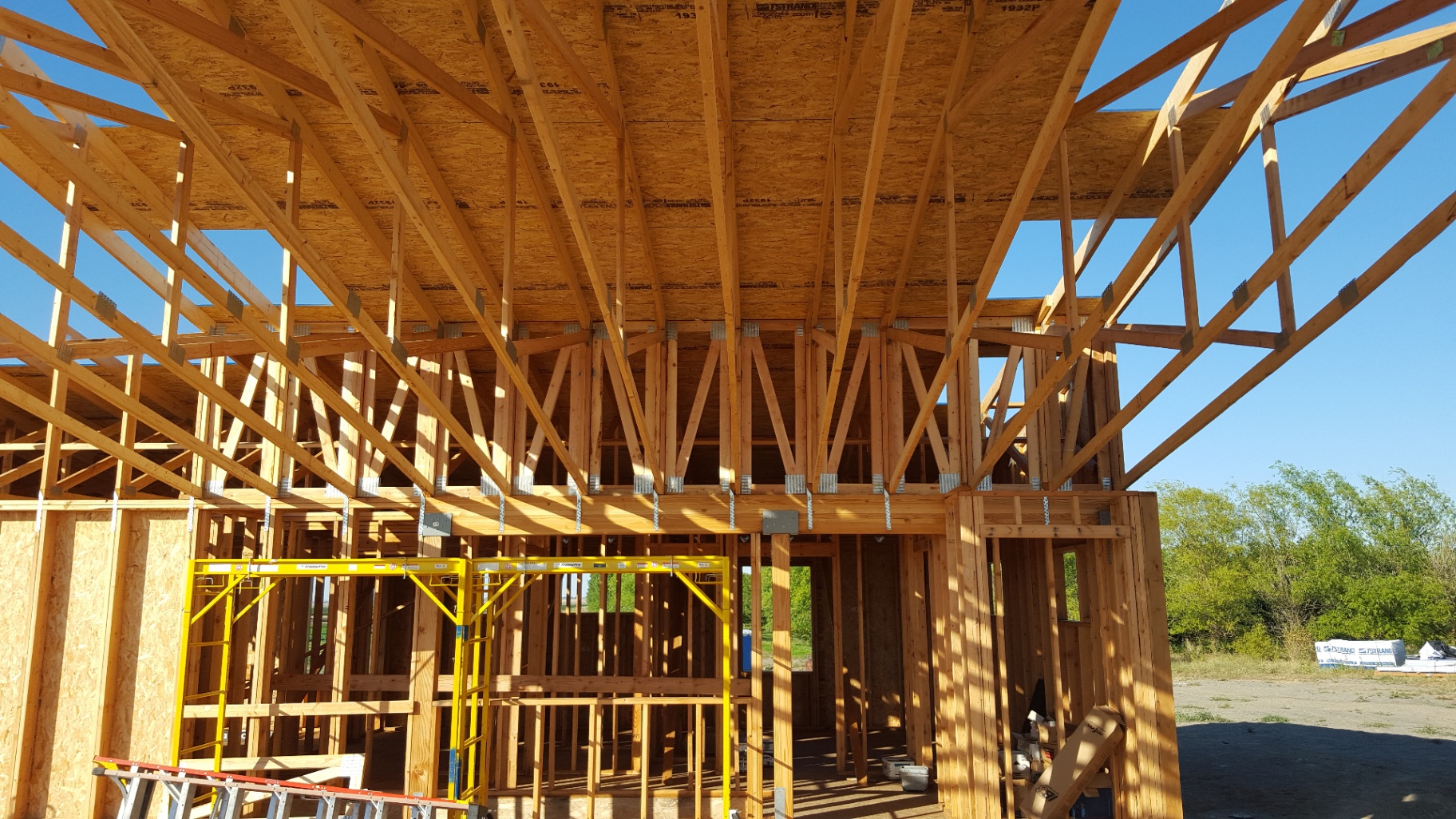 Interior view of wood truss roof system with structural framing